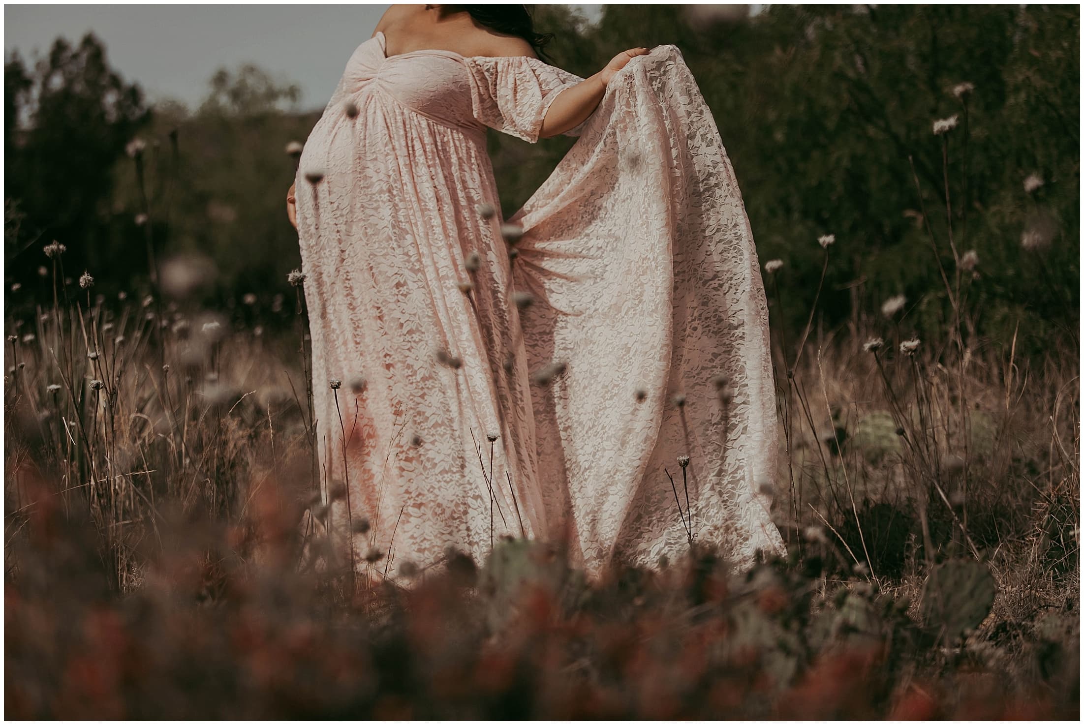 Pink lace long maternity dress with flower halo head band photoshoot in Palo Duro Canyon State Park belly shot