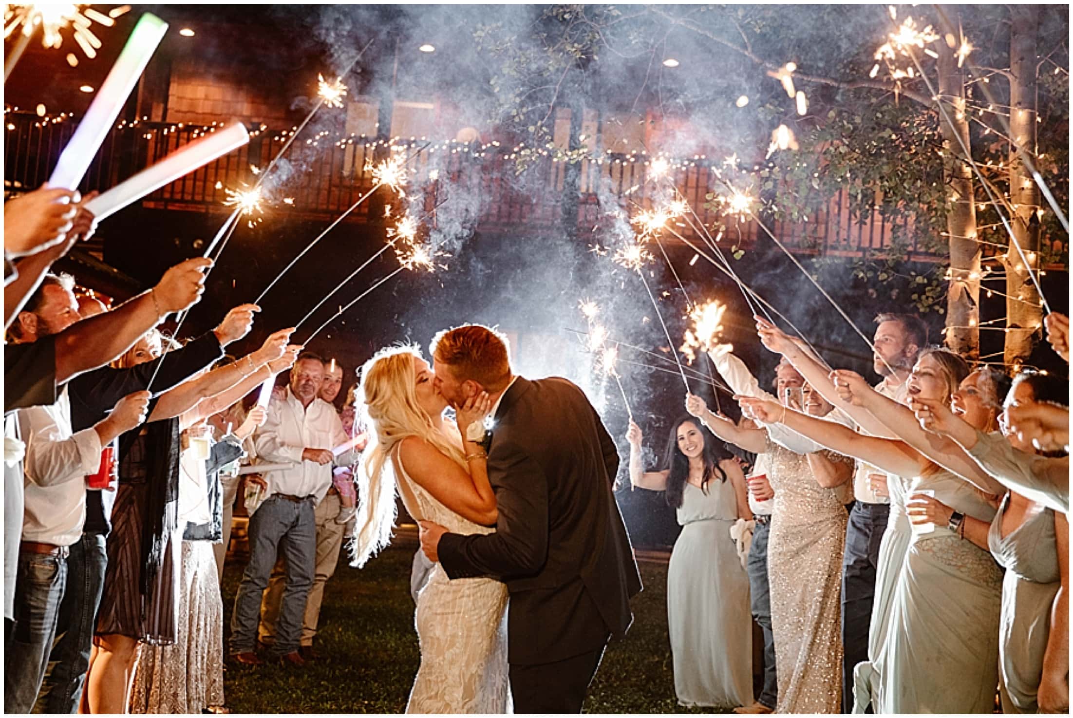 fireworks at wedding, sparkler exit, bride and groom exit kiss, wedding party holding sparklers, Aspen Lodge, Red River New Mexico, Red River New Mexico Wedding, Weddings in New Mexico, Destination mountain wedding, destination mountain elopement, elopements in new mexico, places to get married in new mexico, destination elopement photographer, mountain wedding photographer, new mexico wedding photographer, new mexico elopement photographer, brit nicole photography, cabin wedding, new mexico cabin wedding, mountain landscape for wedding, small intimate mountain wedding, small intimate river wedding, wedding photographer in new mexico, junebug weddings, the knot, wedding wire, 41 productions with lindsay gomez, dallas texas bride, DJ Allen Gallegos, Tao Cakes, New Mexico Wedding planner karen kelly, barnes jewelry, Lillian West bridal dress, Lang’s Bridal, enchanted florist wedding flowers, places to get married in texas, texas wedding photographer, texas elopement photographer, forest wedding, forest elopement, wooded area for wedding, wooded elopement, elopement in the woods, amarillo wedding photographer, amarillo elopement photographer